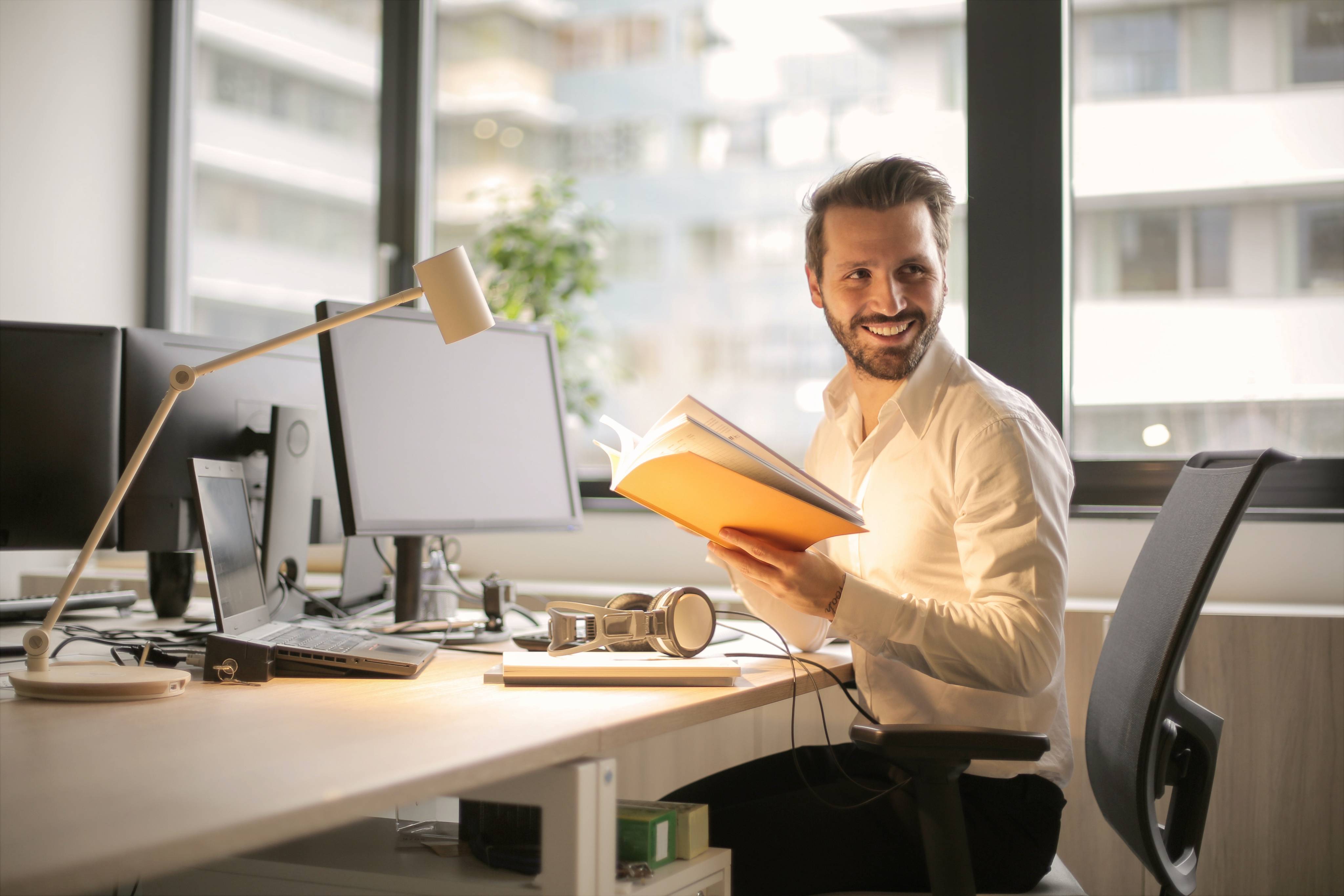 Software Engineer smiles while greeting their new colleague